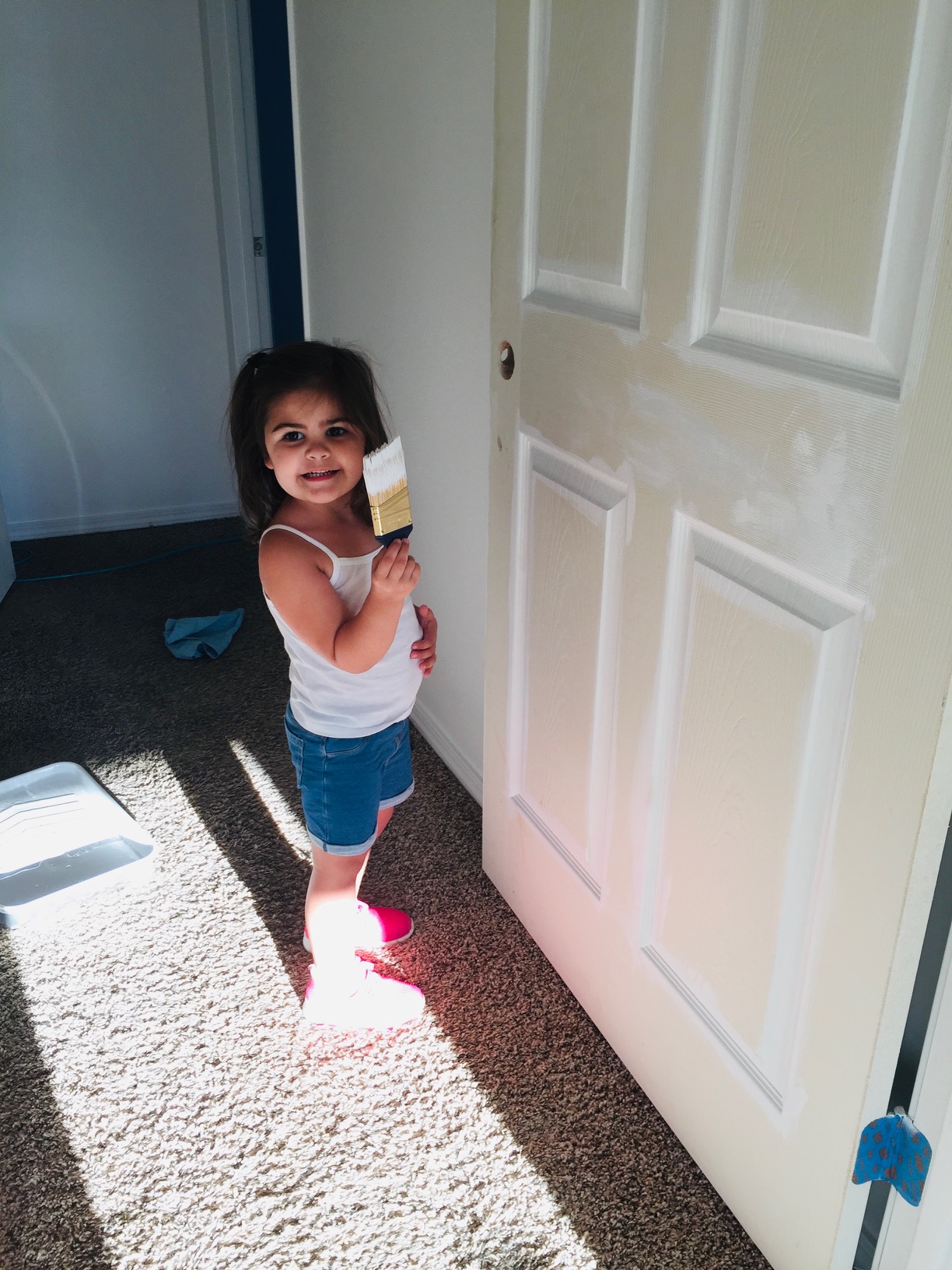 Dylan helping paint at a rental property